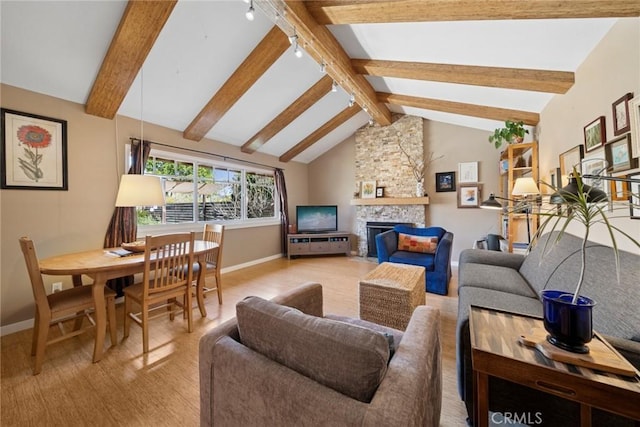 living area featuring a fireplace, wood finished floors, beam ceiling, and baseboards