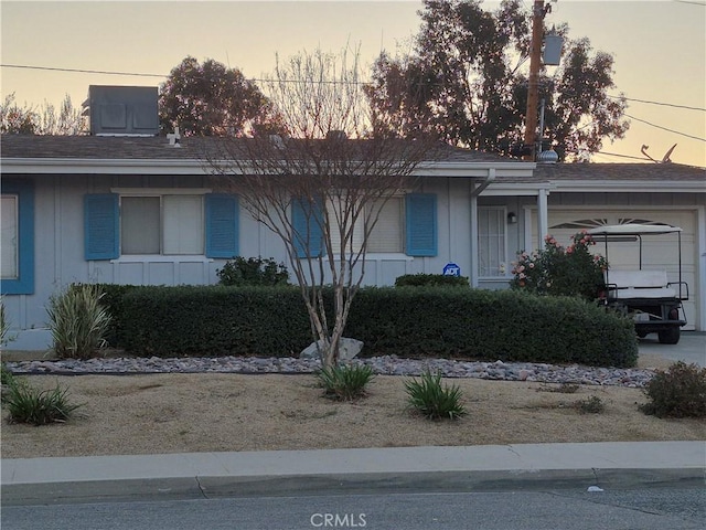 single story home with a garage