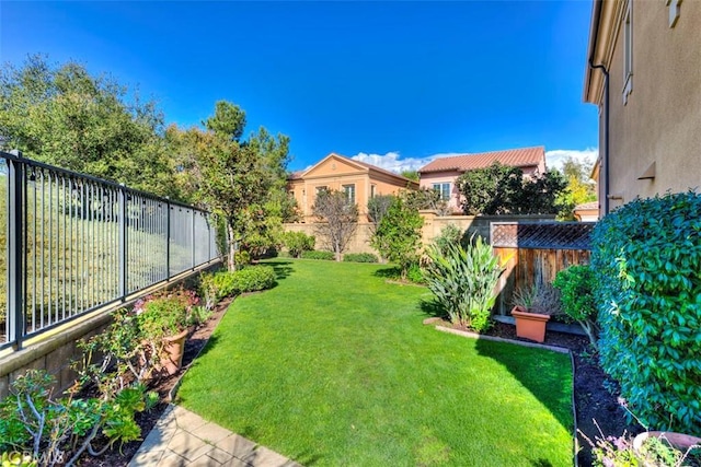 view of yard featuring a fenced backyard