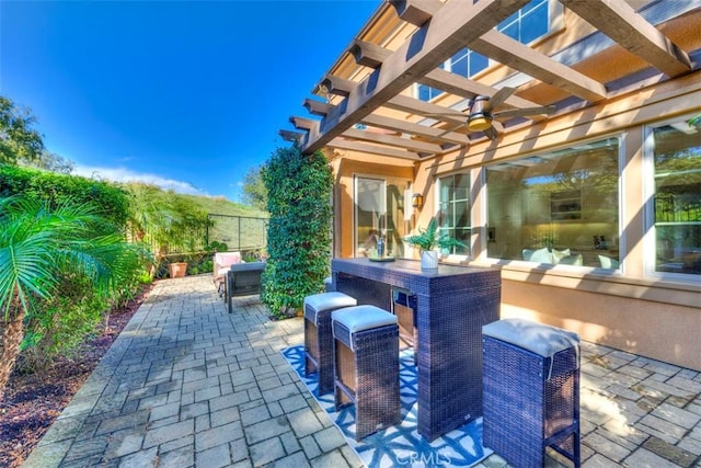 view of patio / terrace featuring fence and a pergola