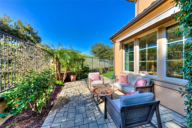 view of patio / terrace with an outdoor hangout area and a fenced backyard