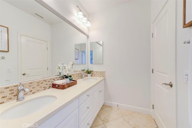 bathroom featuring double vanity, visible vents, backsplash, and a sink