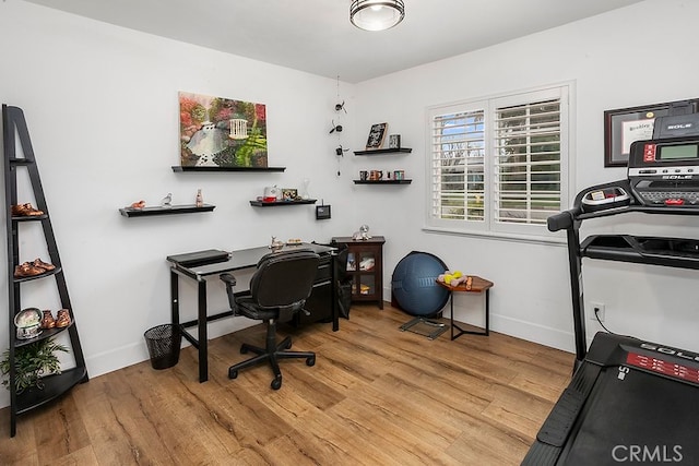 office area with wood finished floors and baseboards