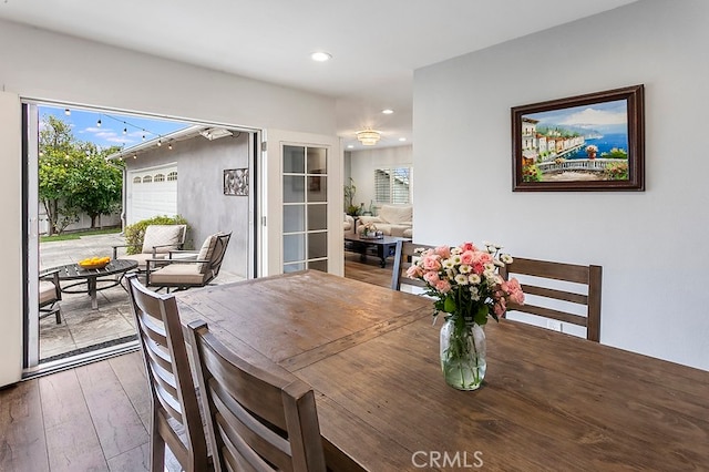 dining area featuring recessed lighting, a healthy amount of sunlight, and hardwood / wood-style floors