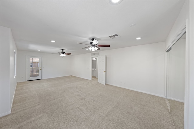 unfurnished room featuring light carpet, baseboards, visible vents, and recessed lighting