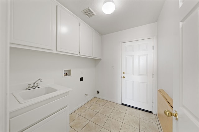 laundry room with cabinet space, visible vents, hookup for a washing machine, hookup for an electric dryer, and a sink