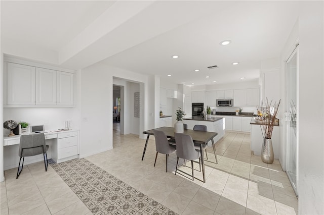 dining room with light tile patterned flooring, visible vents, built in desk, and recessed lighting