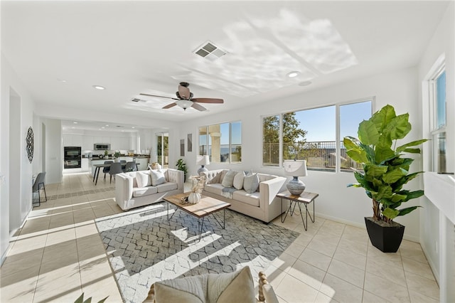 interior space with a ceiling fan and visible vents