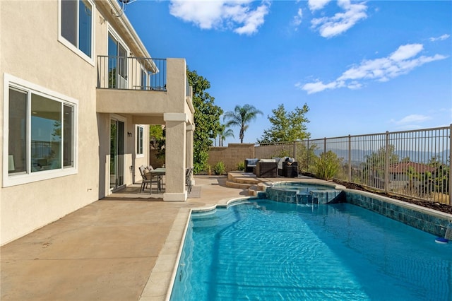 view of swimming pool with a pool with connected hot tub, a fenced backyard, a patio, and an outdoor hangout area