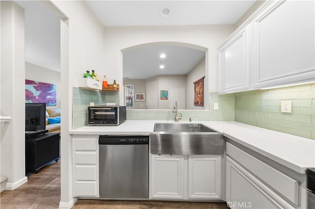 kitchen with dishwasher, a toaster, backsplash, and a sink