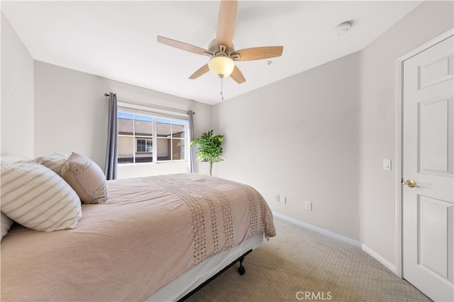 bedroom featuring baseboards, carpet, and a ceiling fan