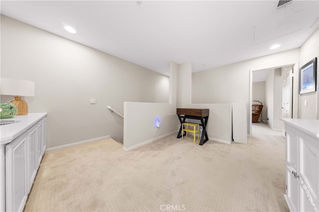 interior space with recessed lighting, visible vents, light carpet, and baseboards