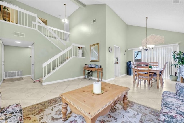 living room featuring light tile patterned flooring, visible vents, stairway, and an inviting chandelier