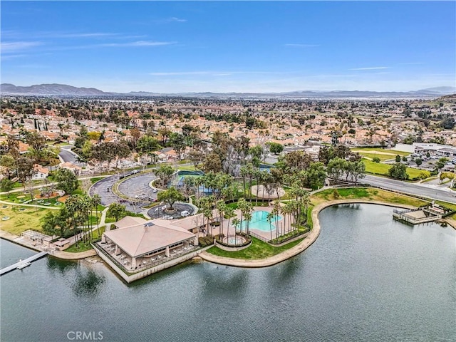 drone / aerial view featuring a water and mountain view