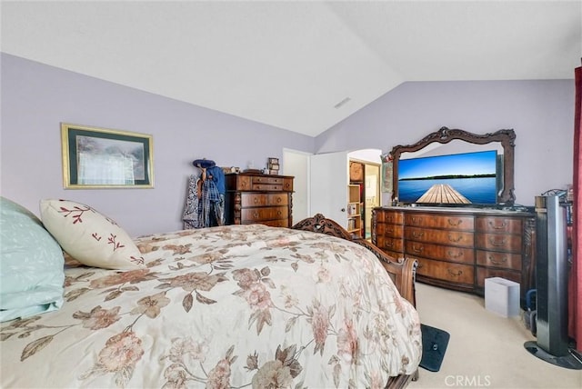 bedroom featuring light carpet and lofted ceiling