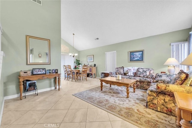 living area with light tile patterned floors, visible vents, a chandelier, and high vaulted ceiling