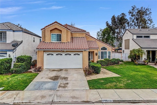 view of front of house featuring concrete driveway, a tile roof, fence, a front lawn, and stucco siding