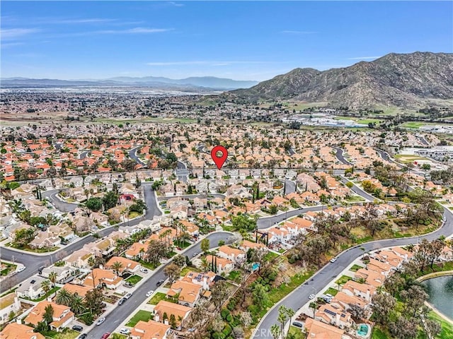 drone / aerial view featuring a residential view and a water and mountain view