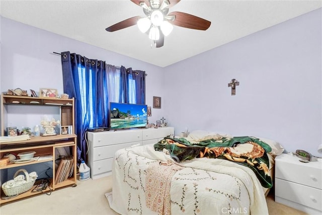 carpeted bedroom with a ceiling fan