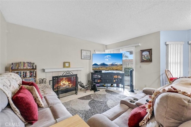 tiled living room with a fireplace and a textured ceiling