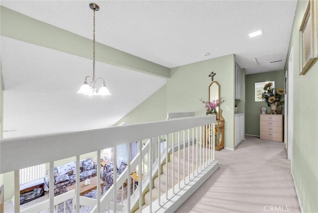 corridor featuring lofted ceiling with beams, light carpet, an upstairs landing, baseboards, and an inviting chandelier