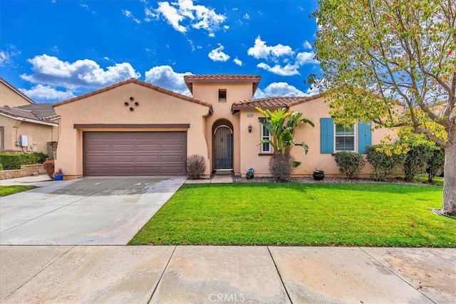 mediterranean / spanish home with an attached garage, a tile roof, concrete driveway, stucco siding, and a front yard