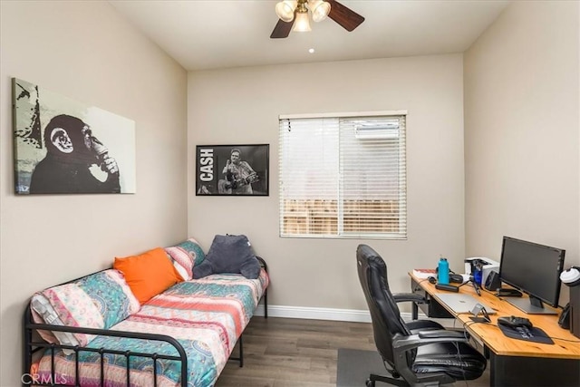 office featuring wood finished floors, a ceiling fan, and baseboards