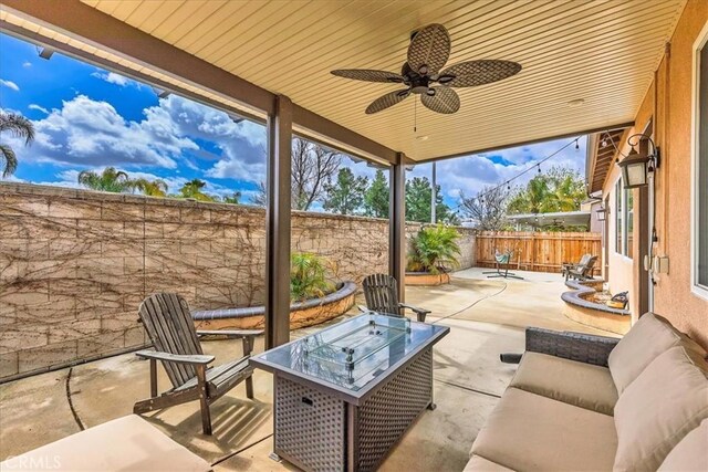 view of patio featuring ceiling fan and a fenced backyard