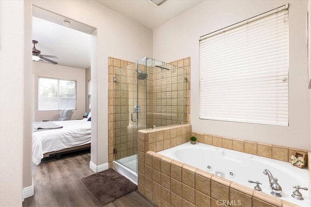 full bath with ceiling fan, connected bathroom, wood finished floors, a shower stall, and a whirlpool tub