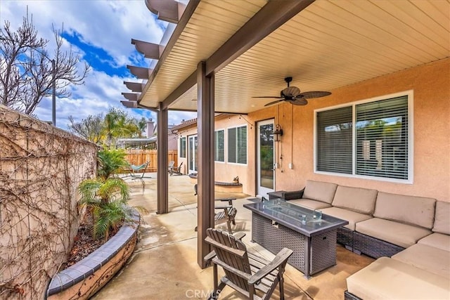 view of patio / terrace featuring fence, outdoor lounge area, and a ceiling fan