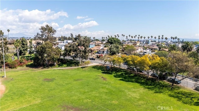 view of community with a residential view and a yard