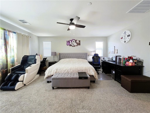 bedroom with multiple windows, carpet flooring, and visible vents