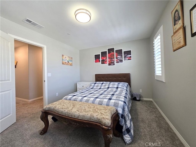 carpeted bedroom featuring visible vents and baseboards