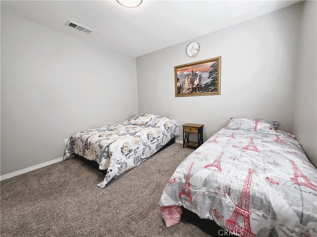 carpeted bedroom with baseboards and visible vents