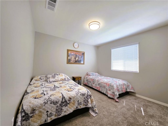 bedroom featuring carpet, visible vents, and baseboards