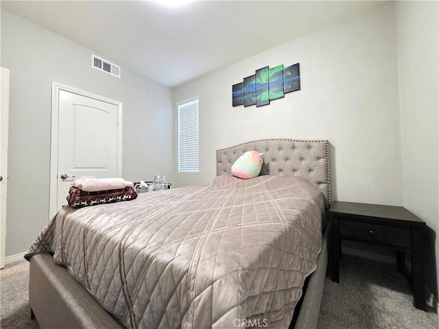 bedroom featuring carpet, visible vents, and baseboards