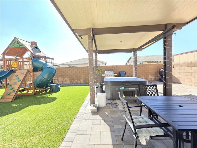 view of patio / terrace featuring outdoor dining area, a fenced backyard, a playground, and a hot tub