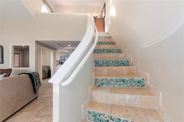 staircase with stone tile floors