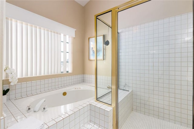 full bathroom featuring a garden tub and a shower stall