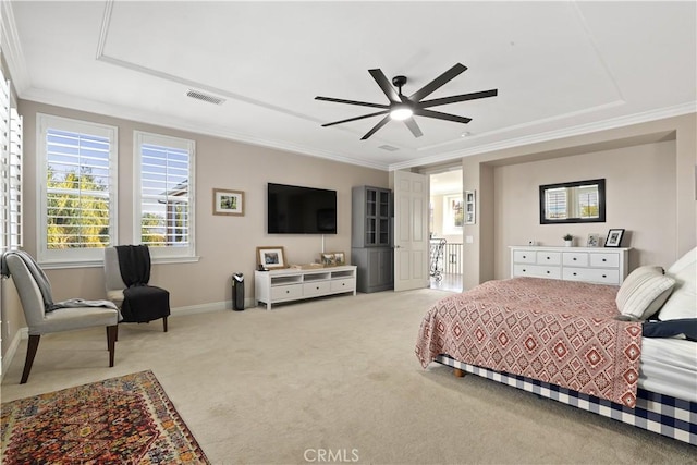 carpeted bedroom featuring visible vents, baseboards, a ceiling fan, and crown molding