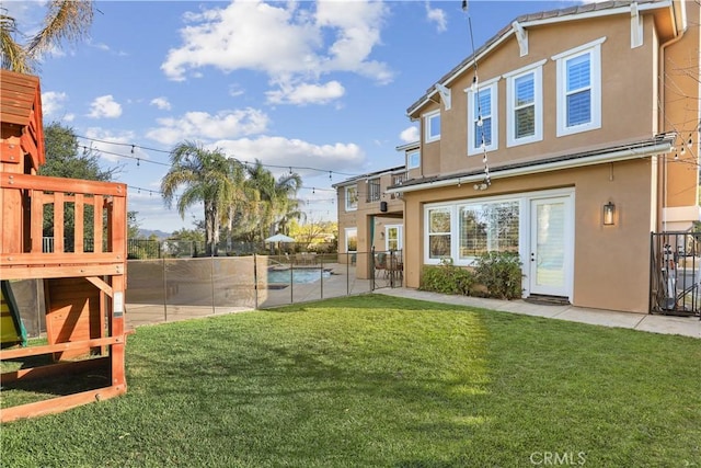 view of yard featuring a fenced in pool, a patio area, and fence