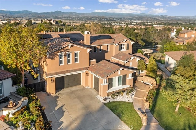 birds eye view of property featuring a mountain view and a residential view