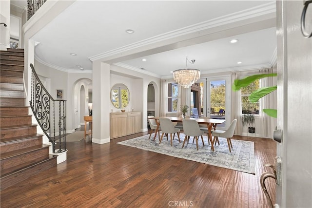 dining room featuring hardwood / wood-style floors, stairs, recessed lighting, and baseboards