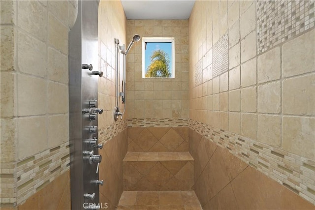 full bath with a tile shower