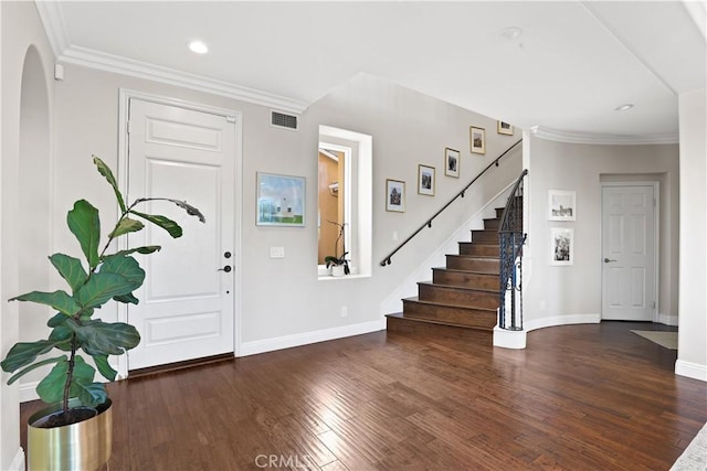 foyer featuring stairs, wood finished floors, visible vents, and baseboards