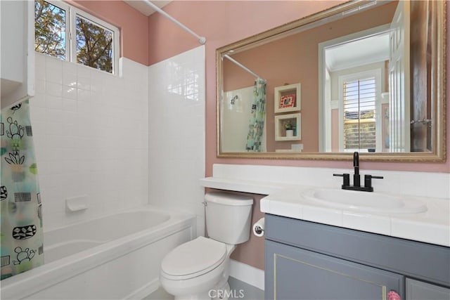 bathroom with vanity, toilet, and shower / tub combo with curtain