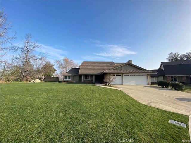 single story home featuring driveway, an attached garage, and a front yard