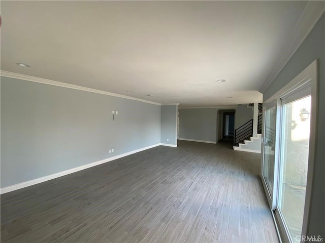 unfurnished room with crown molding, stairway, dark wood-style floors, and baseboards