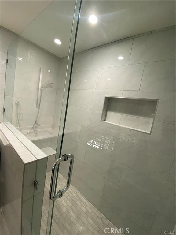 full bathroom featuring a shower stall