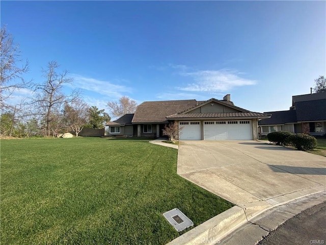 ranch-style house featuring concrete driveway, an attached garage, and a front lawn